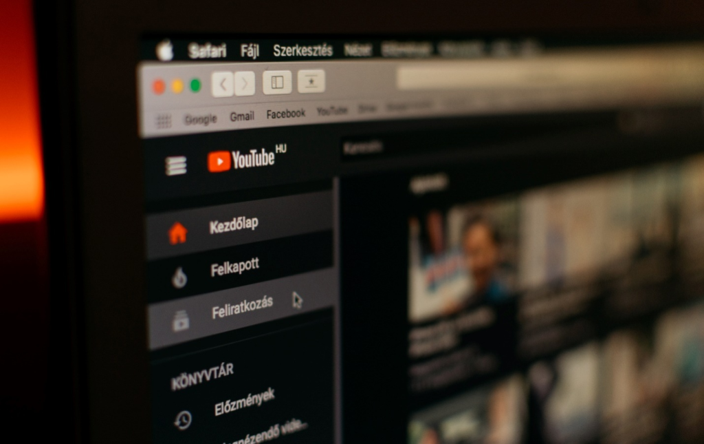 A screen shows the YouTube homepage
