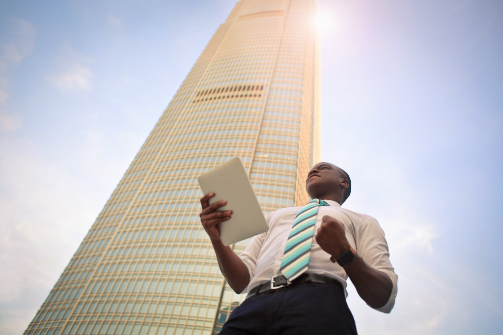 Businessman Standing Next to a Building