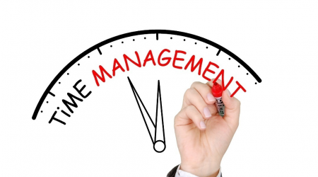 A person writing time management
