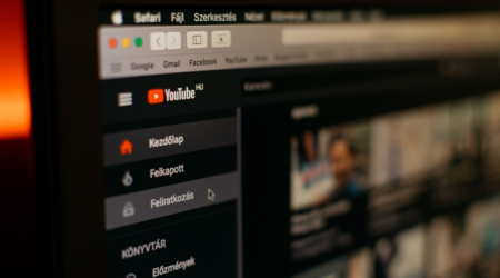 A screen shows the YouTube homepage